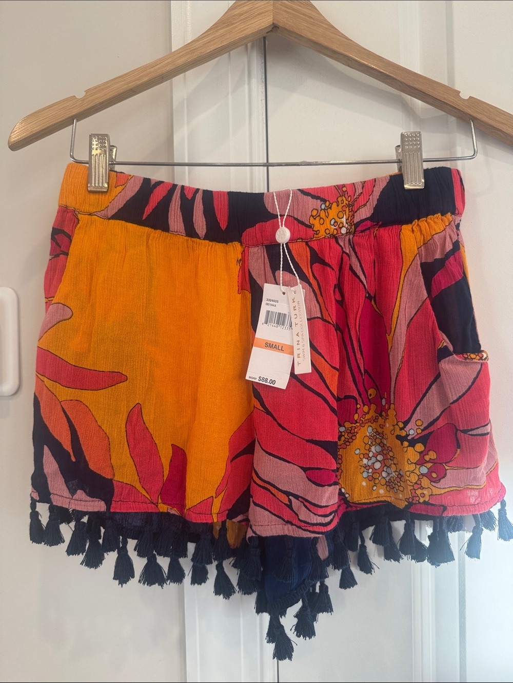 Trina Turk Bright Floral Tassel Hem Shorts in Pink and Orange.